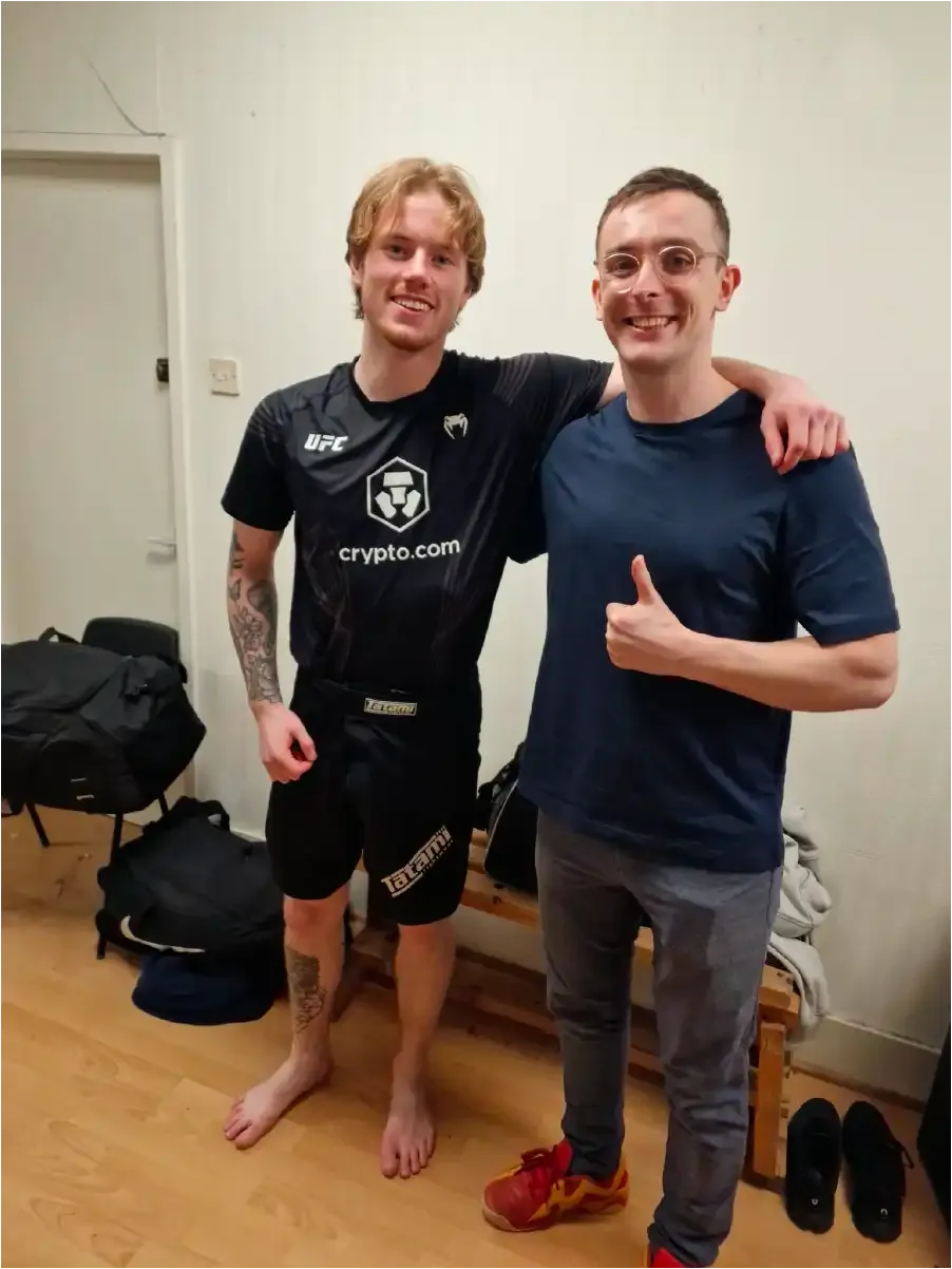 Client giving thumbs up after sports injury rehabilitation