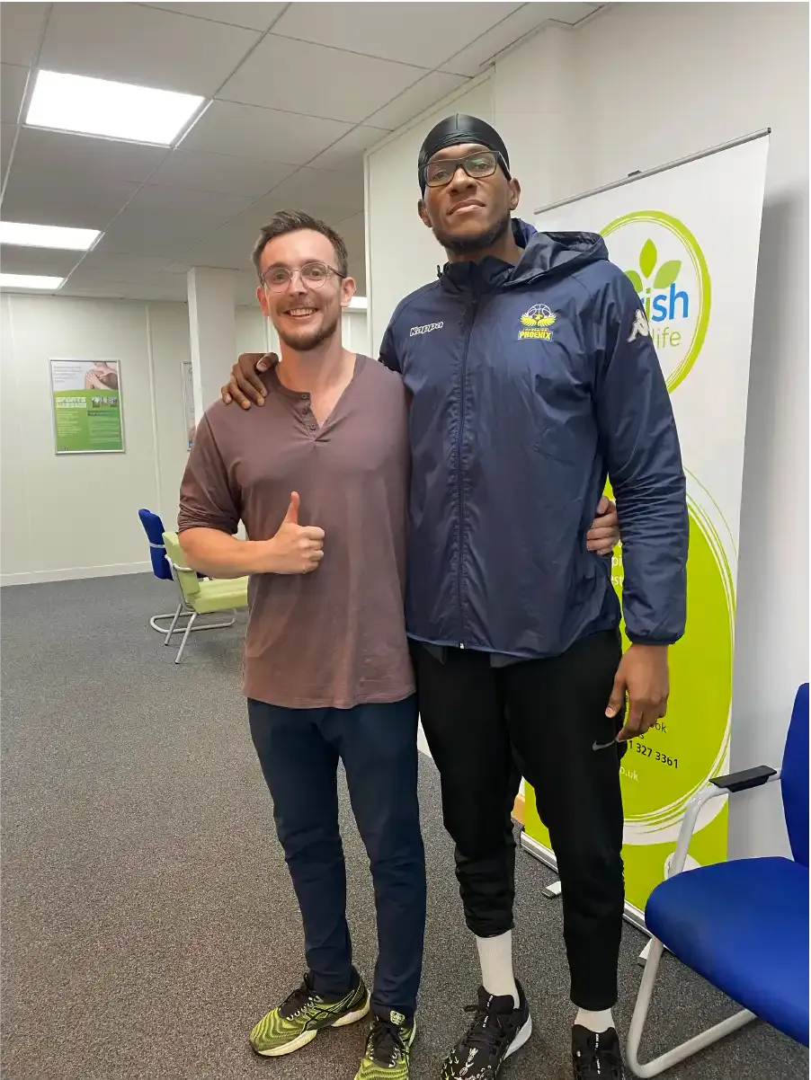 Connor Flynn with athlete after successful rehabilitation