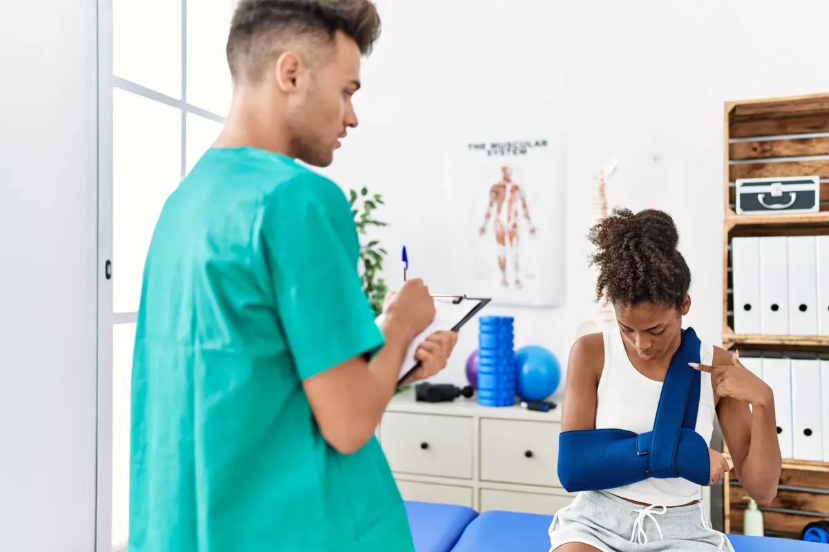 Physiotherapy clinic consultation room with treatment bed and equipment