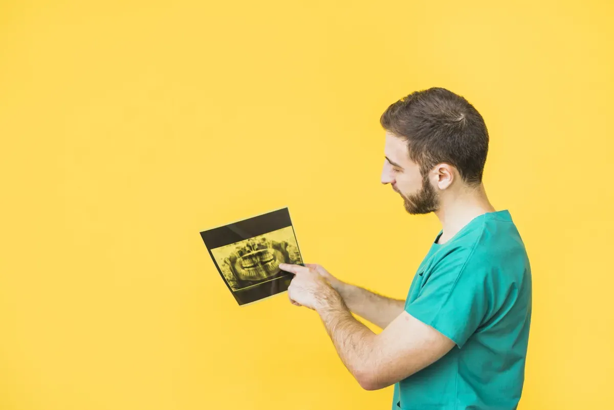Medical professional reviewing MRI scan results on screen